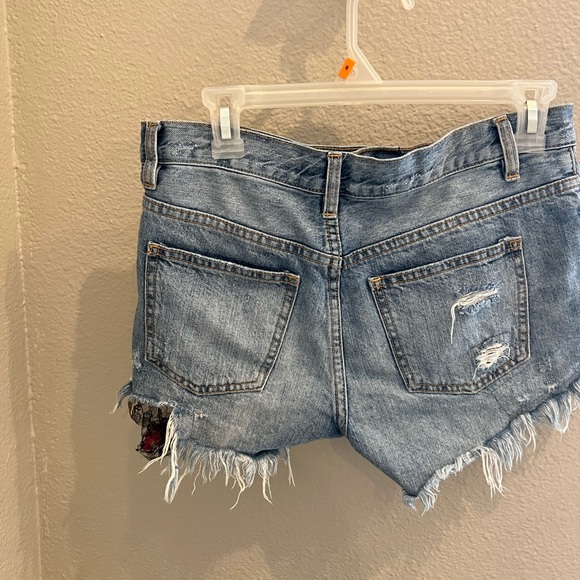 Free People We The Free Cutoff Floral Lace Ripped Denim Shorts - Picture 2 of 5